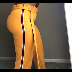 Mustard (bootcut/bell cut) pants.